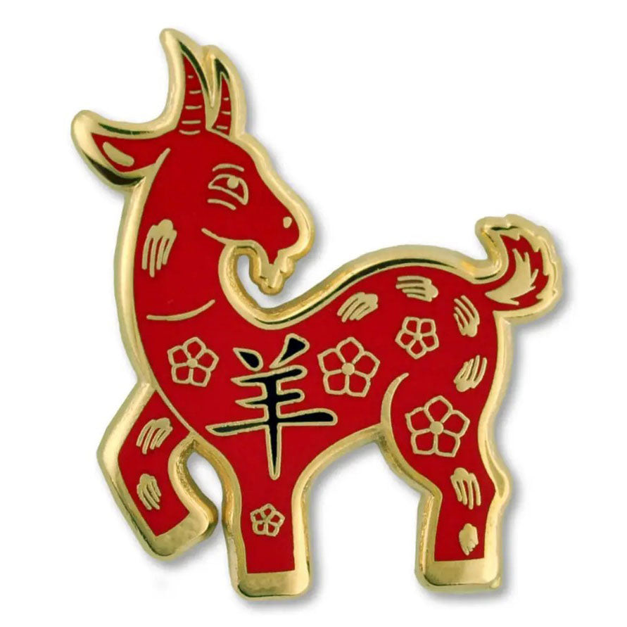 Red and gold Goat Zodiac pin with Chinese characters on a white background