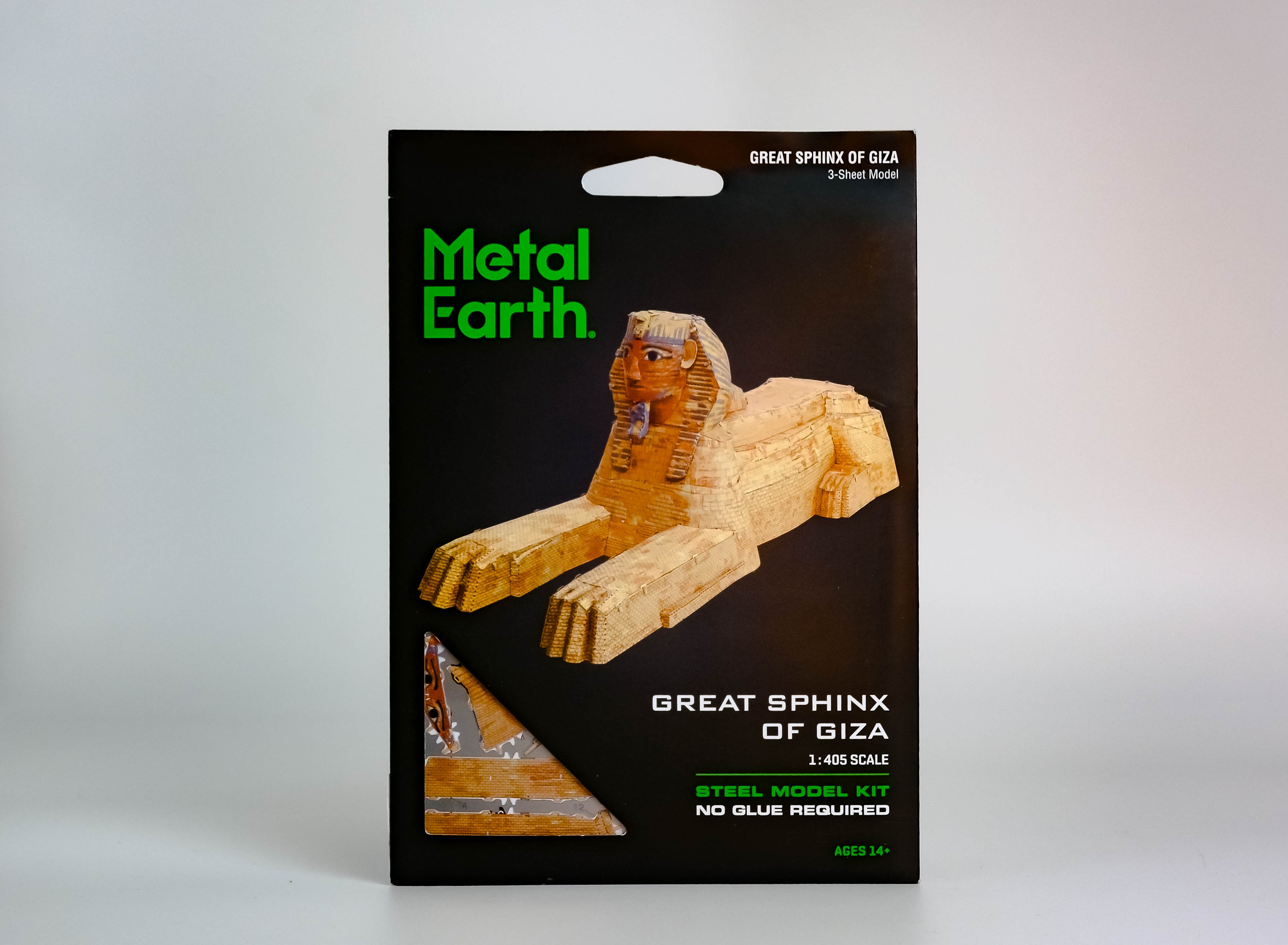 Black activity kit with green text "metal earth," red-brown Great Sphinx of Giza in center. On white background. 