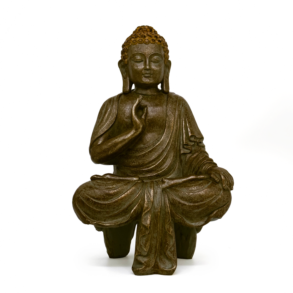 Siddhartha Gautama Buddha seated in cross leg position with right hand by chest, white background. 